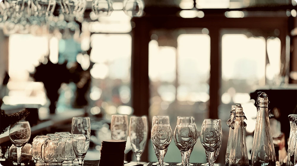 Empty wine glasses on a table at a licensed event