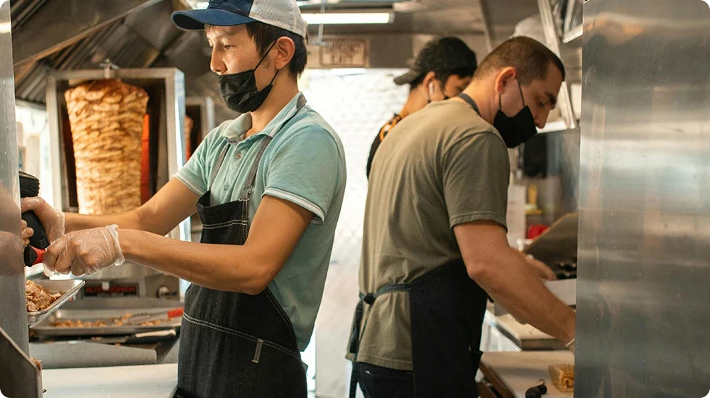 Image showing a busy restaurant kitchen with a potential risk of a food safety hazard