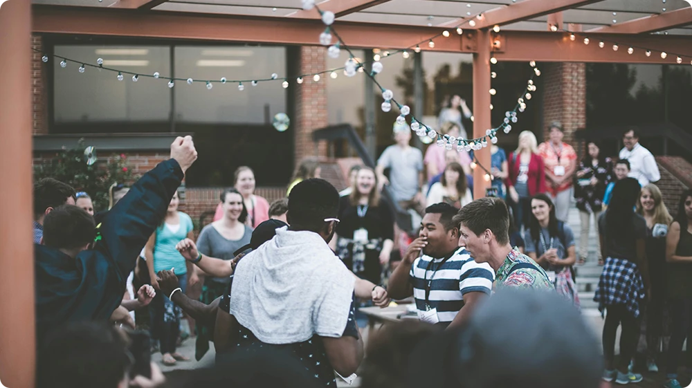 Group of people dancing and enjoying at an event