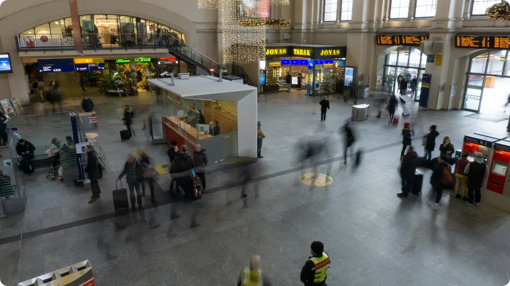 Manned security services in action at a busy transport hub, ensuring crowd safety and monitoring movement