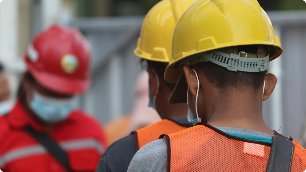 Health and safety officer inspecting workplace for hazards