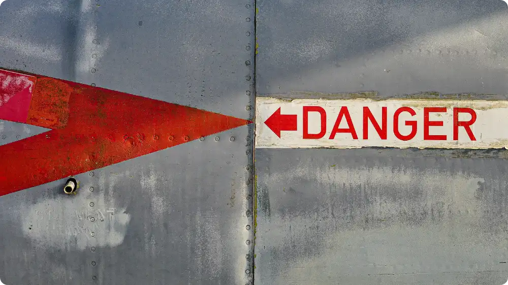 A sign that shows �Danger� at a workplace or in the outdoors as a result of adequately assessing the risks that the area presents.