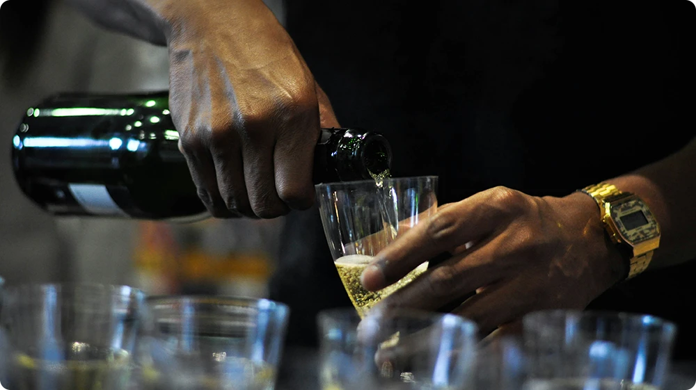 Close-up of alcohol being served in a glass, illustrating responsible service to adults