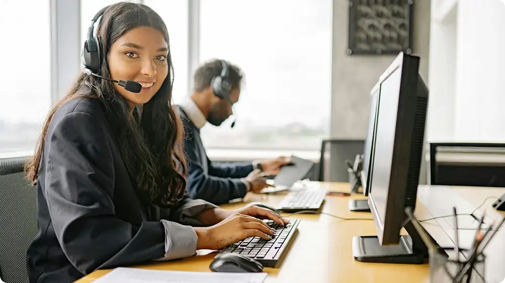 Customer service team assisting with SIA contact number and security licence enquiries via helpline.