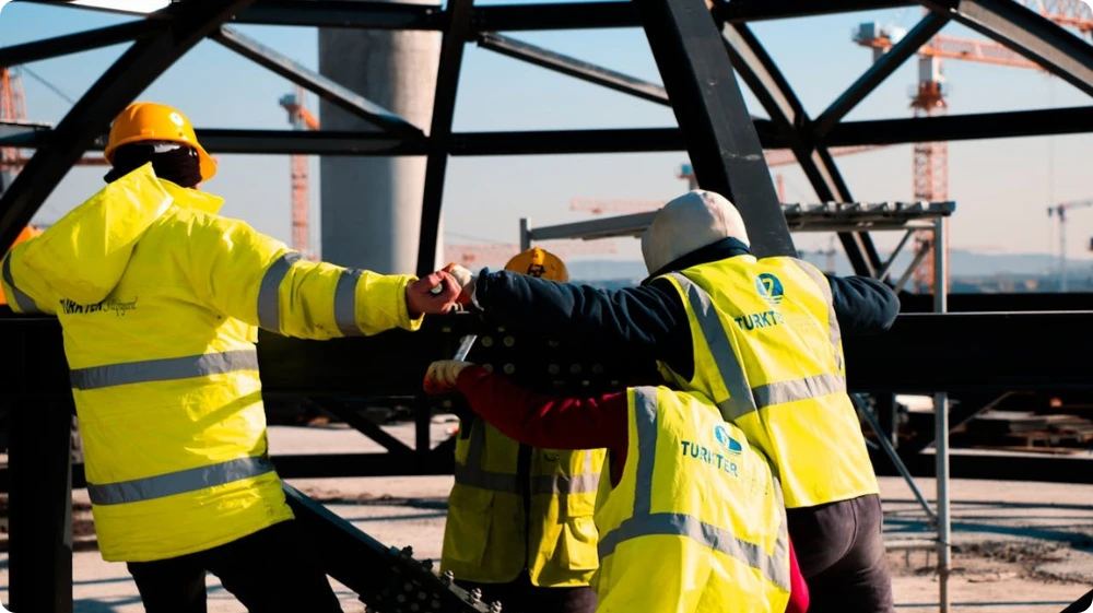  Team members learning workplace safety through IOSH training 