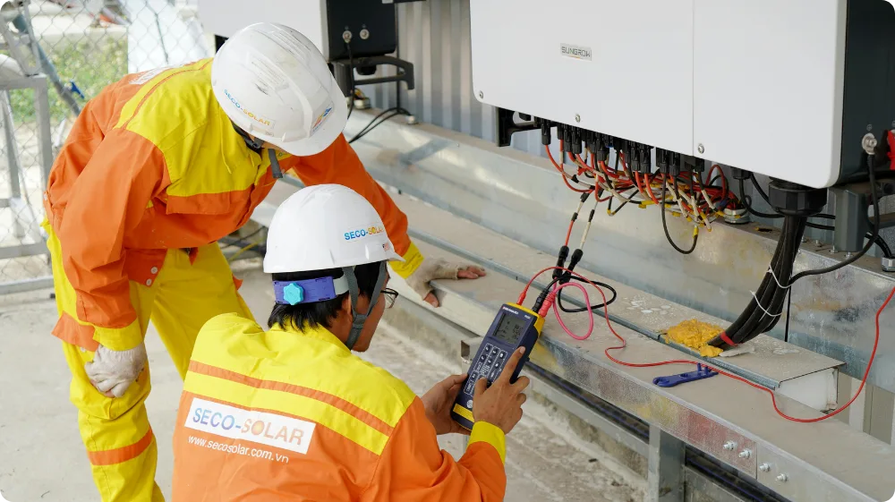 An electrician wiring a system for the NVQ Level 3 Electrical Certificate