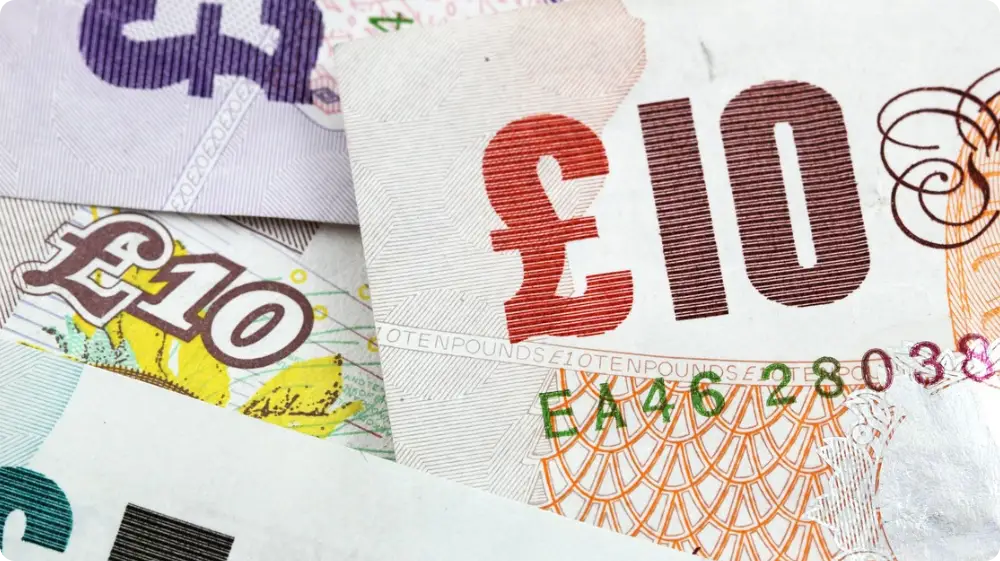 British currency notes symbolising NVQ course costs for painters