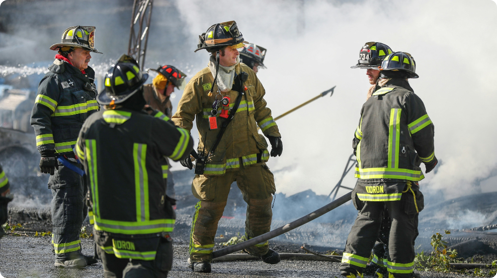 Manufacturing workplace with accessible fire extinguisher station 